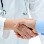 Handshake with patient